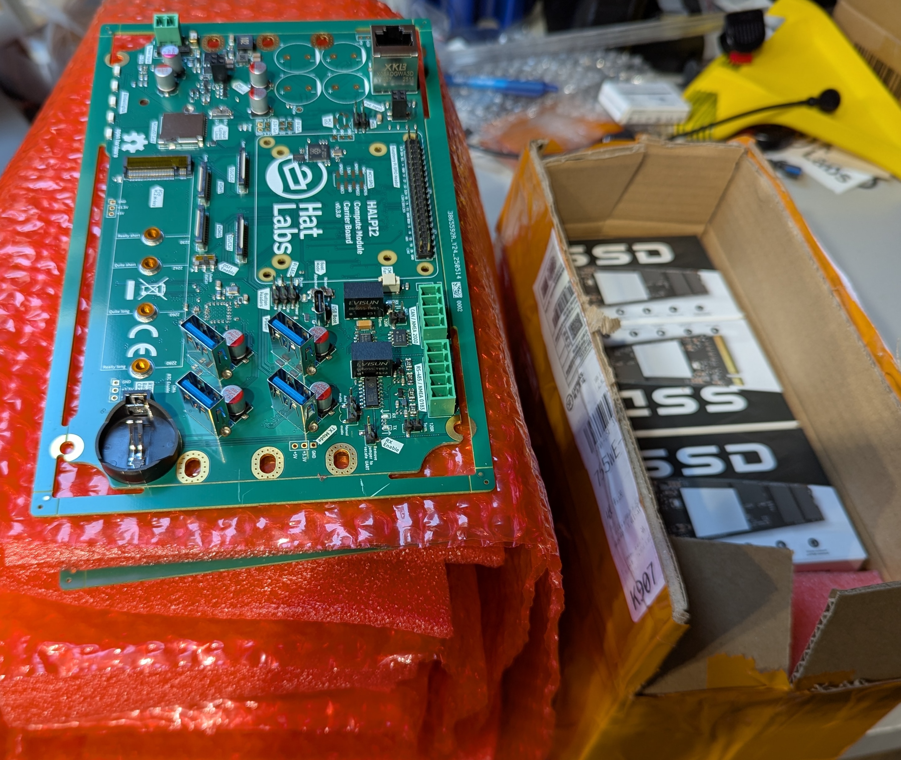 HALPI2 v0.3.0 PCBs and a box of SSDs